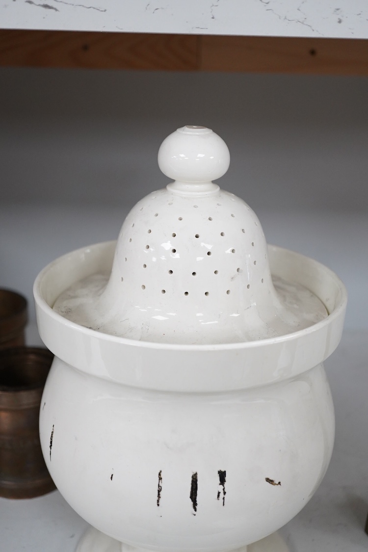 A Victorian pottery pedestal leeches jar and pierced cover, with the remains of the painted word ‘leeches’ around the body of the jar, 30.5cm high